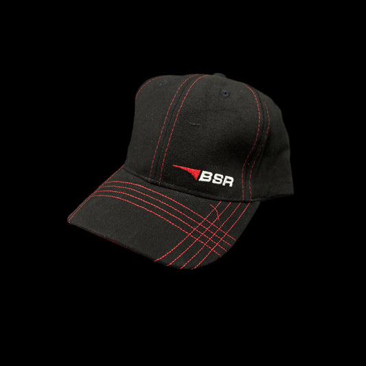 Black cap with red stitching and BSR logo on a dark background